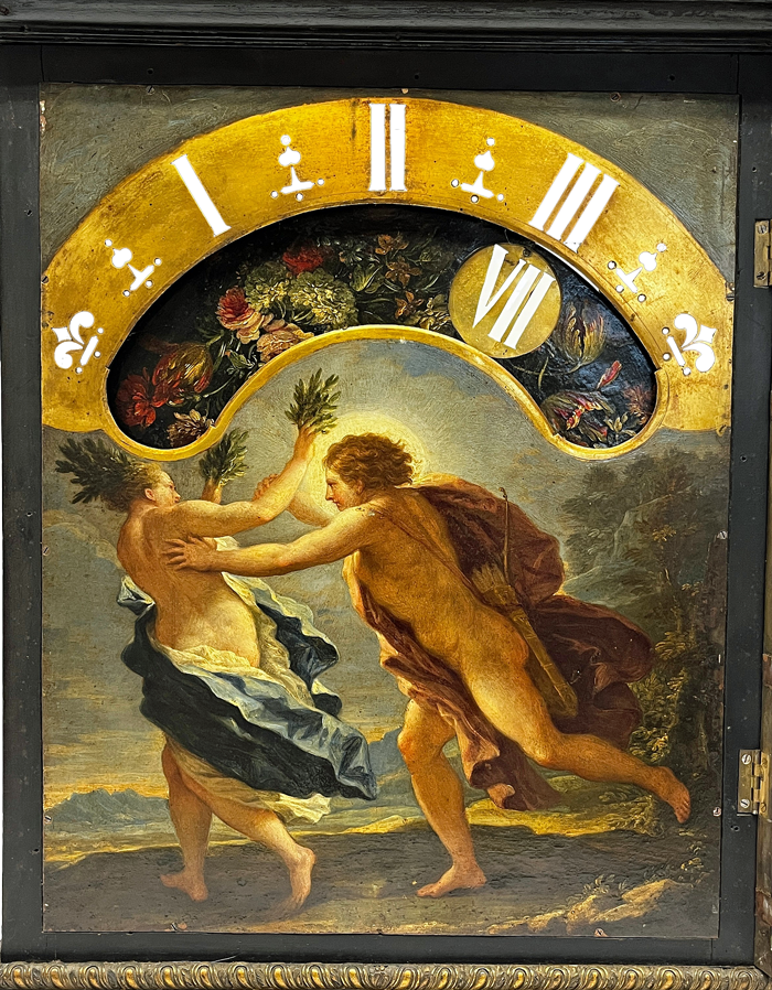 Its a quarter to eight on this backlit Italian night clock dial from the late 17th century, with 'wandering hours' moving