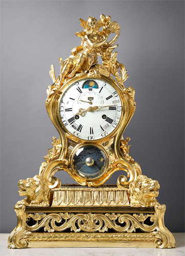 A very important Louis XV gilt bronze astronomical mantle clock of eight day duration, signed on the case below the white enamel dial Millot