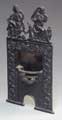 Fire place, an English cast iron 'porte montre' (pocket watch stand), c. 1900.